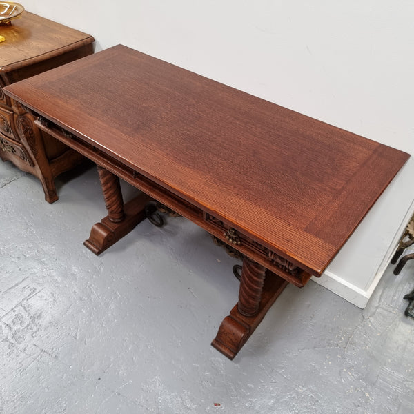 Amazing French Oak Spanish style console table with three drawers and decorative carvings. This piece is in great original condition and has been sourced from France. Circa 1930's.