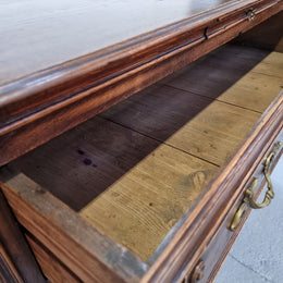 Early 19th century carved Oak three-drawer commode. Beautiful handles and has a small hidden drawer at the top. In good original detailed condition. Please note keys are not included.