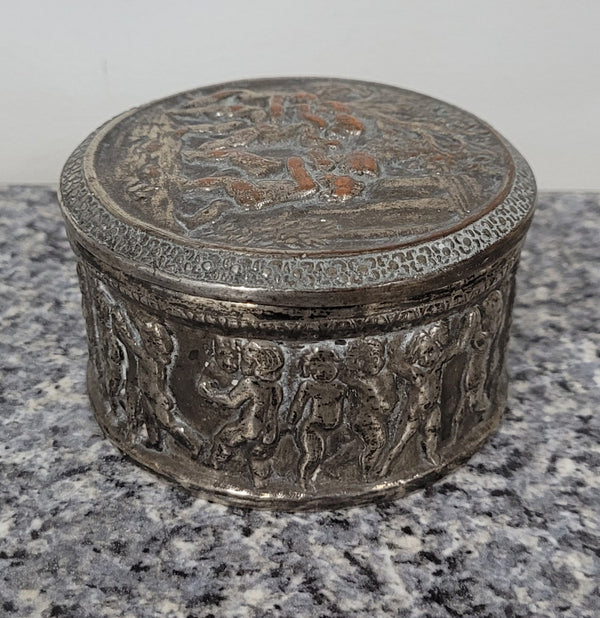 Unusual Antique silver over pottery Italian trinket box nicely decorated with Cherubs. It is in good original condition, please view photos as they help form part of the description.