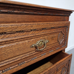 Early 19th Century French Oak chest of three drawers. It has beautiful handles and carvings. It is in good original detailed condition.