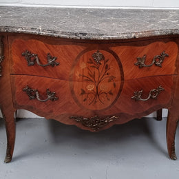 Beautiful French walnut Louis XV style two drawer commode. With a lovely floral marquetry inlaid design and marble top. It is in good original detailed condition.