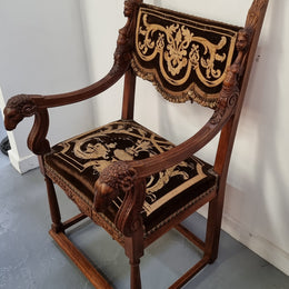 Beautifully carved Walnut Egyptian Revival armchair with amazing hand sewn Stumpwork embroidery coverings. In good original detailed condition.