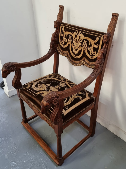 Beautifully carved Walnut Egyptian Revival armchair with amazing hand sewn Stumpwork embroidery coverings. In good original detailed condition.