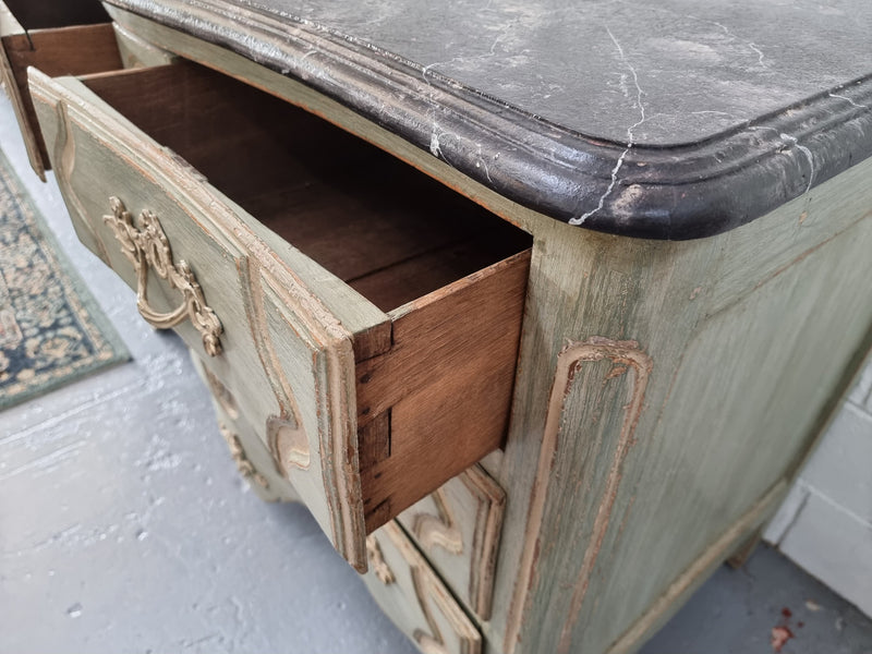 Early 19th Century Louis XIV style faux marble top and painted base commode. It is of large proportions and has four drawers. In good original detailed condition.