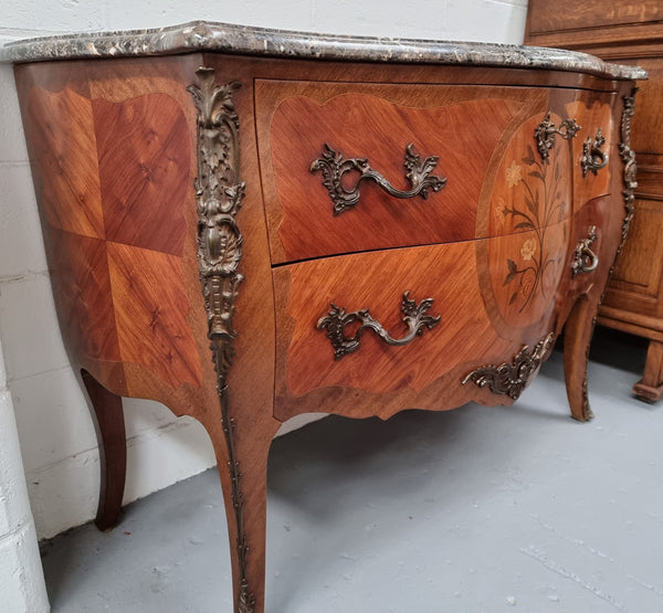 Beautiful French walnut Louis XV style two drawer commode. With a lovely floral marquetry inlaid design and marble top. It is in good original detailed condition.
