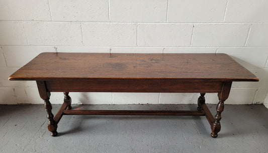 Rustic French Oak pedestal base coffee table. It is in good original detailed condition.