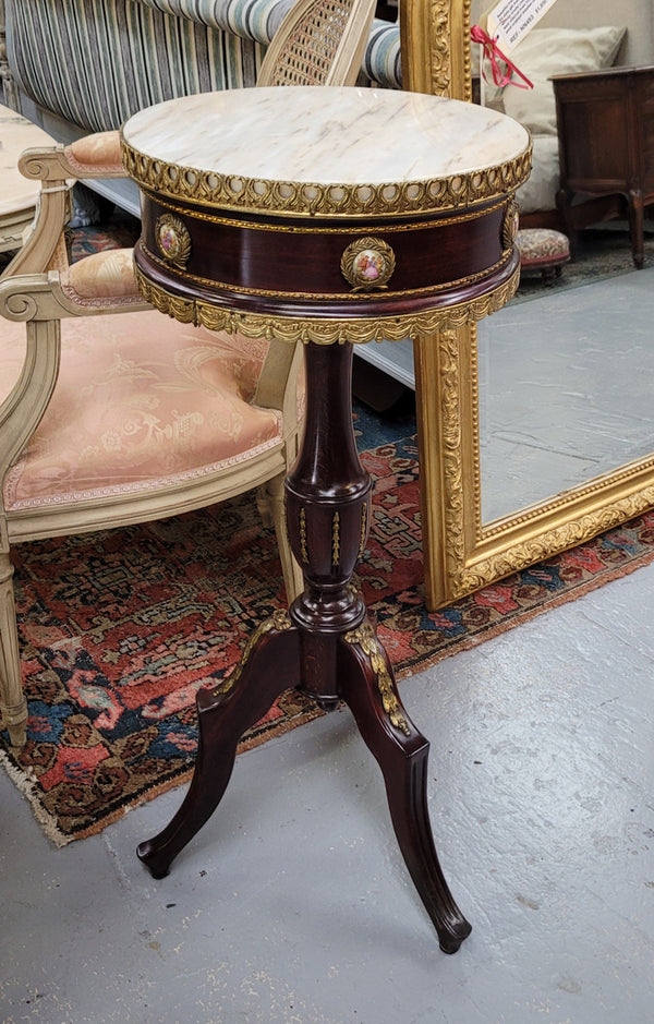 Elegant French louis XVI revival style round marble top side table with ceramic features and ormolu decoration. It is in good original detailed condition and has been sourced from France.