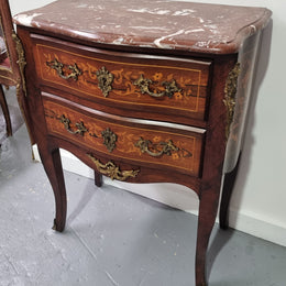 A stunning French petite two drawer inlaid Rosewood commode. In good original detailed condition.