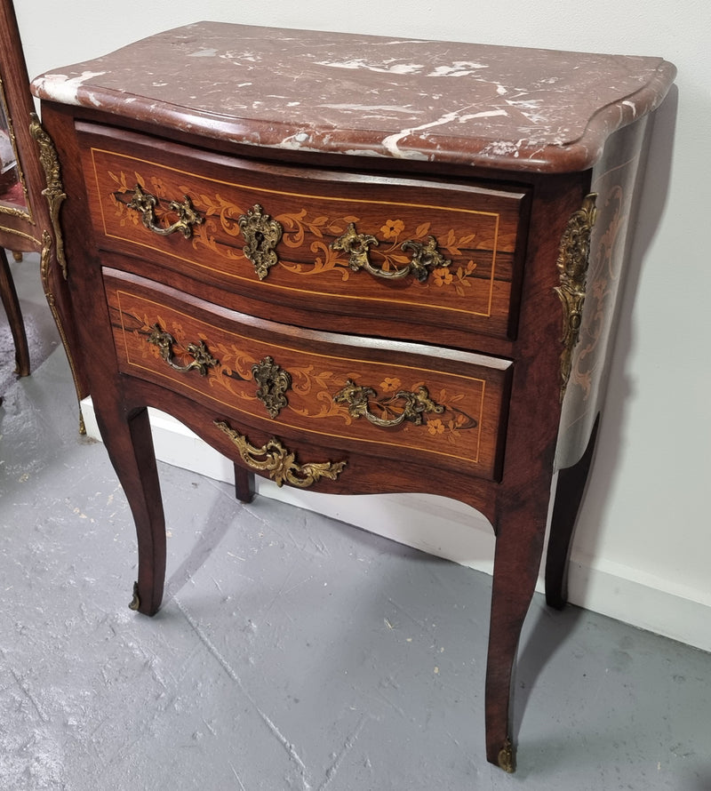 A stunning French petite two drawer inlaid Rosewood commode. In good original detailed condition.