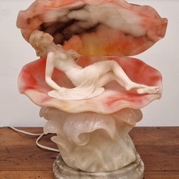 A superb original hand carved Art Deco lamp. Alabaster and marble sculpture of a nude woman inside a clam shell. Italian, inscription to base. Circa 1920's. Subtle colouring to clam shell for a sunset effect. This is a world class example of a true Art Deco sculpture lamp. It is in good original detailed condition, please view photos as they help form part of the description.