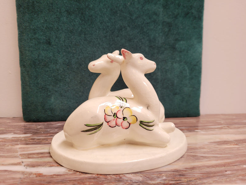 Goldscheider Myott Art Deco figurine of two Gazelle figures with hand painted flowers.  Backstamp dates the figures to 1938-1950 period.  There is some light crazing.