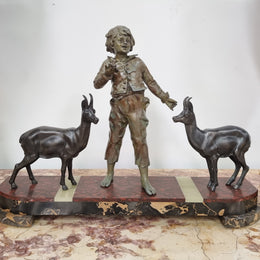 French Art Deco spelter and marble statue of a boy and two deers in good original condition.