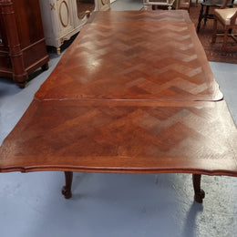 Beautiful French Oak Louis XV style parquetry top extension table. When fully extended the tables length is 239 cm. It is in good original detailed condition.