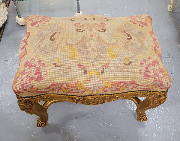 Charming 19th Century gilt wood tapestry covered Louis XV style stool. It has a beautifully carved base and undercarriage and it has been sourced from France. It is in good original detailed condition, please view photos of tapestry has they help form part of the description.