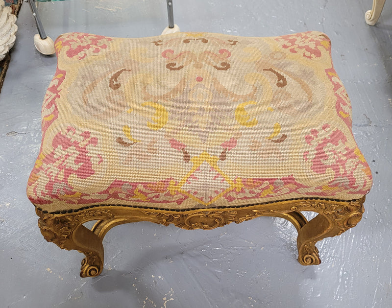 Charming 19th Century gilt wood tapestry covered Louis XV style stool. It has a beautifully carved base and undercarriage and it has been sourced from France. It is in good original detailed condition, please view photos of tapestry has they help form part of the description.