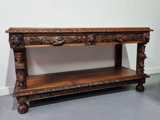 19th Century French Oak Henry the 2nd style console/side table/ TV unit with two drawer with beautiful carvings. It is in good original detailed condition.