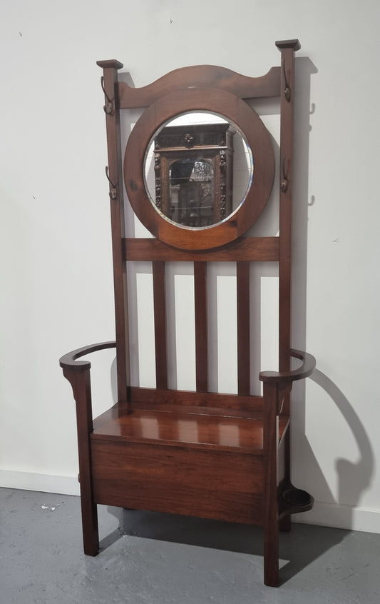 Blackwood Federation hall stand of pleasing narrow proportions. Beautiful round mirror with four lovely hooks and a lift up sit for added storage. In good original condition.
