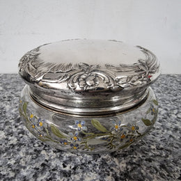 Silver lidded dressing table powder/trinket bowl with beautifully hand-painted floral enamel. In good condition please view photos as they help form part of the description.