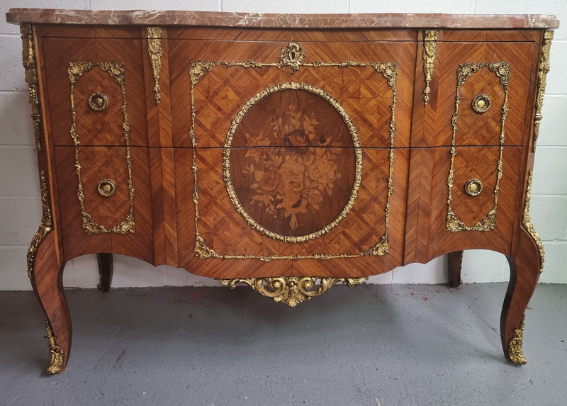 Stunning Louis XV style ormolu and marquetry marble top commode with two drawers. It has an amazing thick marble top and it is in good original detailed condition.