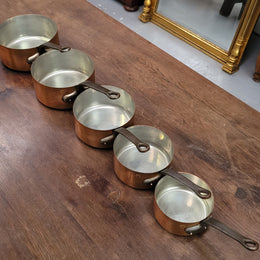 Set of five copper sauce pans with foundry stamp. They have been sourced from France and are in good original detailed condition.