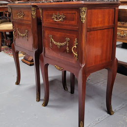 Appealing Louis XV style high quality bedside cabinets with black Portoro marble top and bronze mounts. They have been sourced from France and are in good original condition.