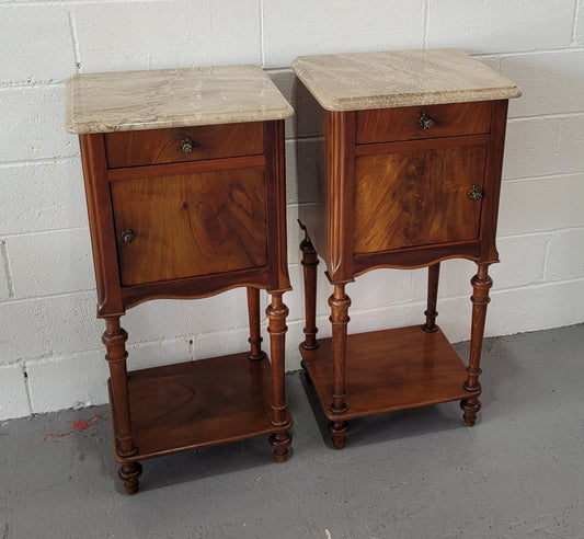 Pair of Louis XVI style walnut bedsides with attractive marble. They have one drawer, one cupboard and are in good original detailed condition.