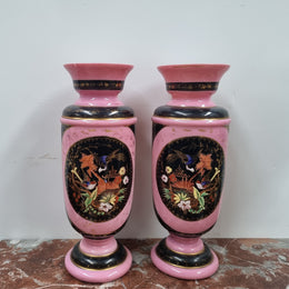Late Victorian pink and hand painted, enameled pair of vases with some ware to enameling. It is in good original condition.