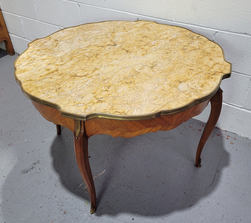 Louis XV style parquetry inlaid coffee table with shaped marble top and ormolu decoration. In good original detailed condition.