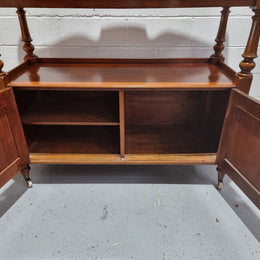 Victorian Mahogany Dumb Waiter with two cupboards, original casters in good detailed condition.