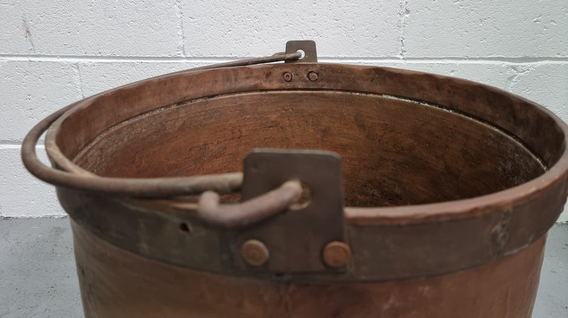 Large Antique French copper cauldron with metal band around rim. It is in good original condition.