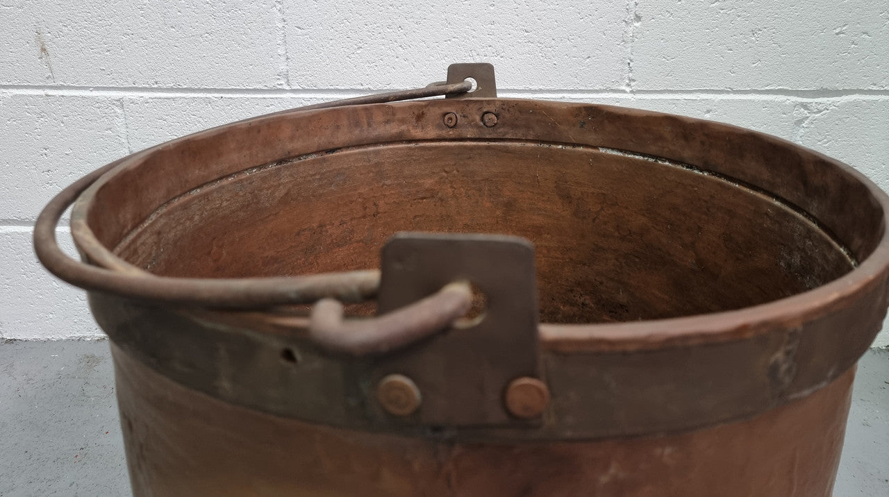 Large Antique French copper cauldron with metal band around rim. It is in good original condition.