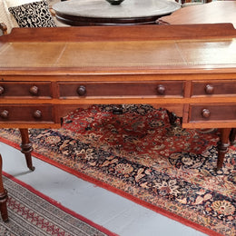 Lovely Victorian Cedar leather tooled  top desk, with five drawers on castors and of pleasing proportions. In very good original detailed condition and has been sourced locally.