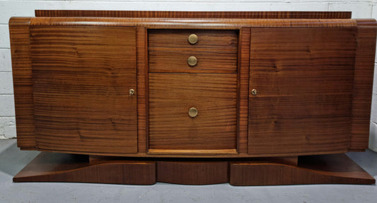 French Art Deco mahogany sideboard, a beautiful example from the Art Deco period. It has plenty of storage with three drawers and two shelved cupboards. It is in good original detailed condition. Circa 1920.