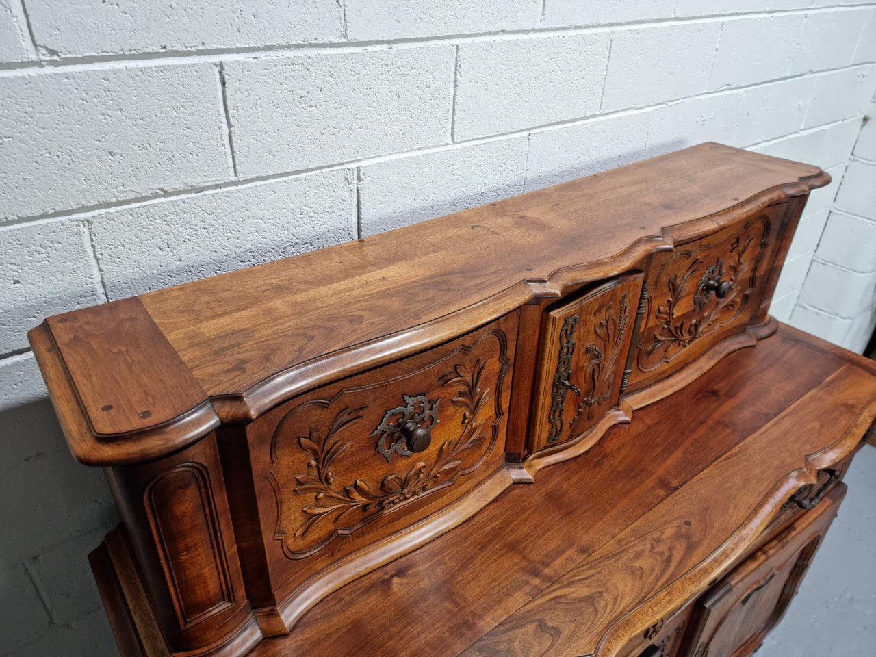 Stunning 19th Century French Walnut Buffet à Glissant from Provence, France. This is an exceptional charming piece and very functional with plenty of storage space, two large cupboards at the bottom, two drawers in the middle and two sliding doors either side at the top and finished off with a small central cupboard. In good original detailed condition.