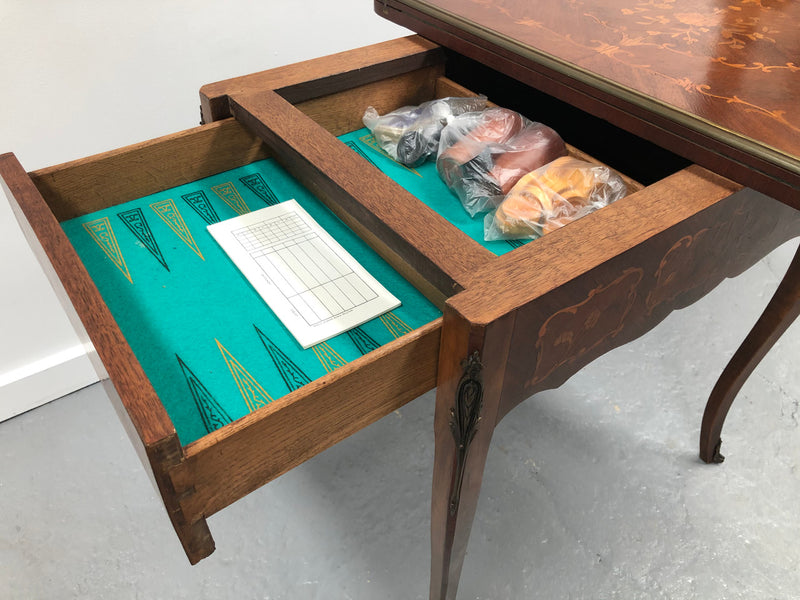 Beautiful french inlaid games table which includes internal drawers and bronze mounts. Internal drawers have counters and cards included.