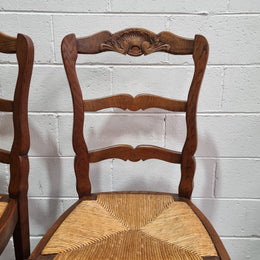 Lovely set of six French oak rush seated provincial dining chairs. They have been sourced from France and are in good detailed condition.