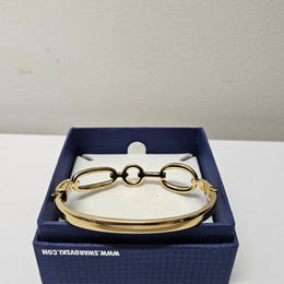 Swarovski gold toned fitted bangle set with Swarovski crystals. Swarovski mark to band, and a side opening. Charming little bracelet. Please see photos as they form part of the description.