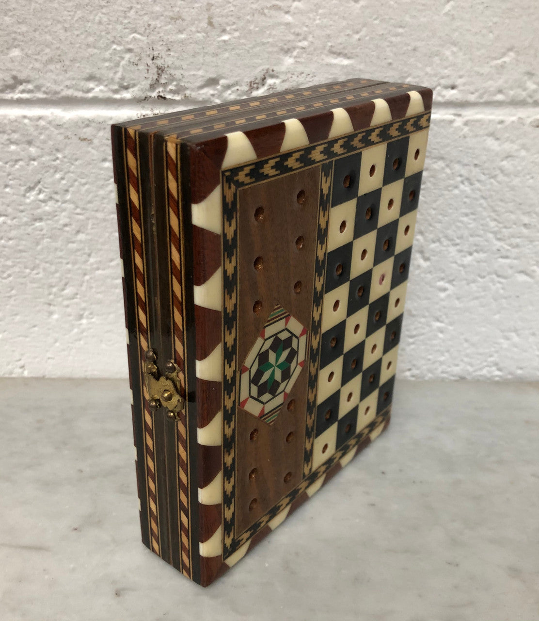 Vintage inlaid folded chess board box with pieces inside. In good clean original condition.