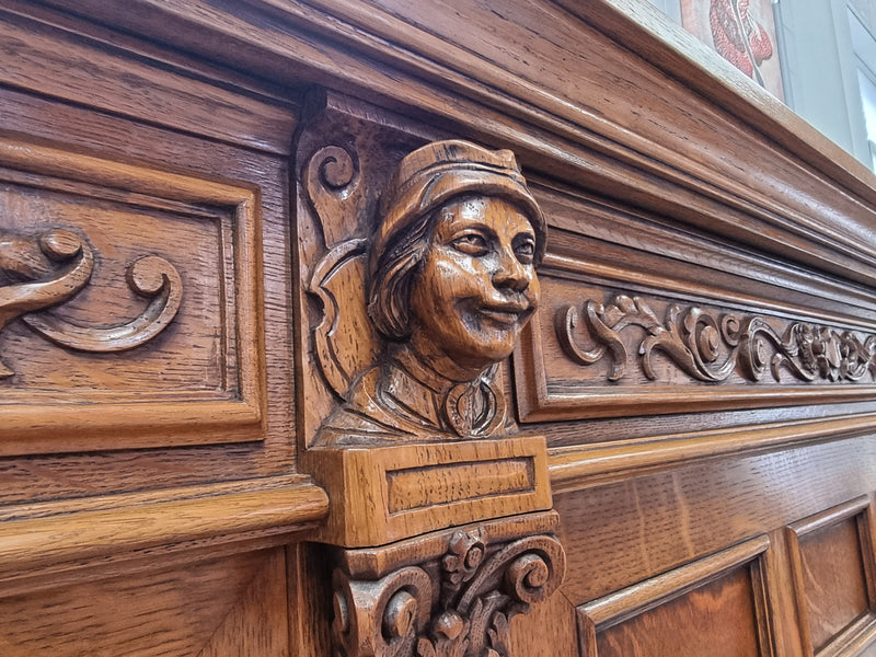 Impressive and grand French Oak Renaissance style sideboard. Beautifully detailed carvings and plenty of storage with three very large cupboards with a total of eight adjustable shelves along with three large drawers. It has been sourced from France and is in very good original detailed condition.