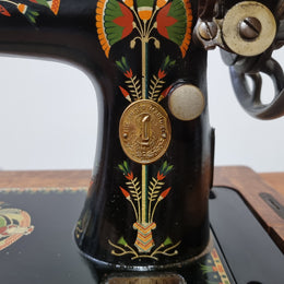 Beautiful Singer sewing machine in an Oak case with six drawers, in mint condition for its age.