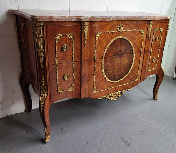 Stunning Louis XV style ormolu and marquetry marble top commode with two drawers. It has an amazing thick marble top and it is in good original detailed condition.