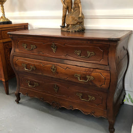 Beautiful 18th Century French all Cherrywood three drawer commode with beautiful ormolu mounts and handles. It is in good original detailed condition.