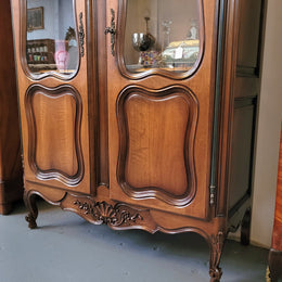 French Walnut Louis XV Style two half glass, door bookcase with three adjustable shelves. Sourced from France and in good original detailed condition.