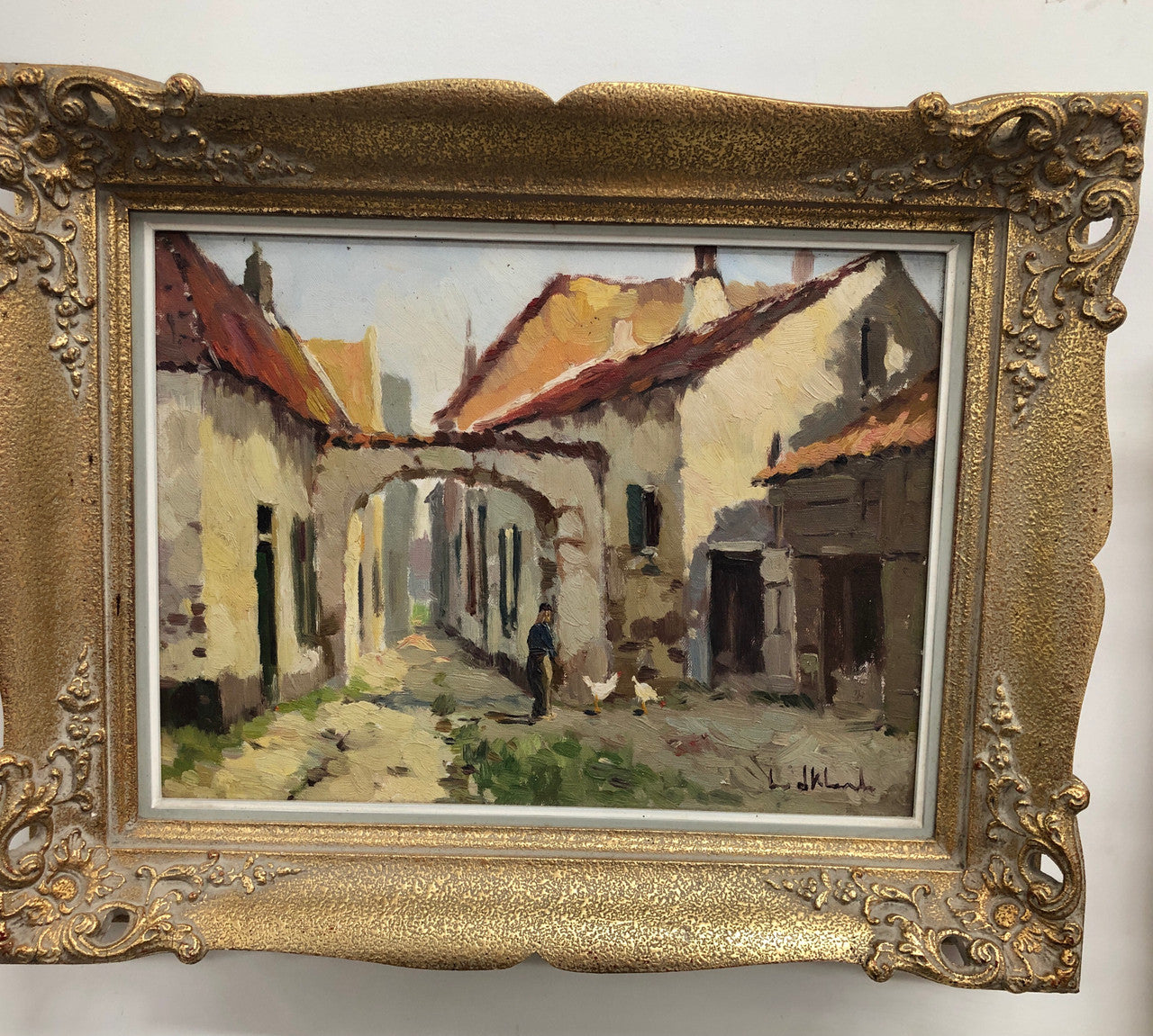 Pair of Vintage framed French oil on canvas of "Village Scenes". They are both in good original detailed condition.