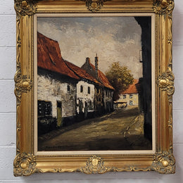 Dutch signed oil on canvas depicting village street in a beautiful gilt frame. It is in good original detailed condition and has been sourced from France.