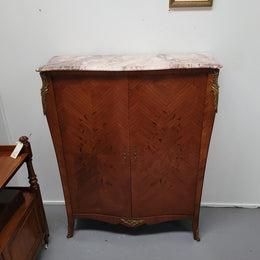 French Louis 15th style Kingwood marquetry inlaid two door cupboard with a beautiful marble top. It has three adjustable shelves and decorative ormolu trim. It has been sourced from France and is in good original detailed condition.
