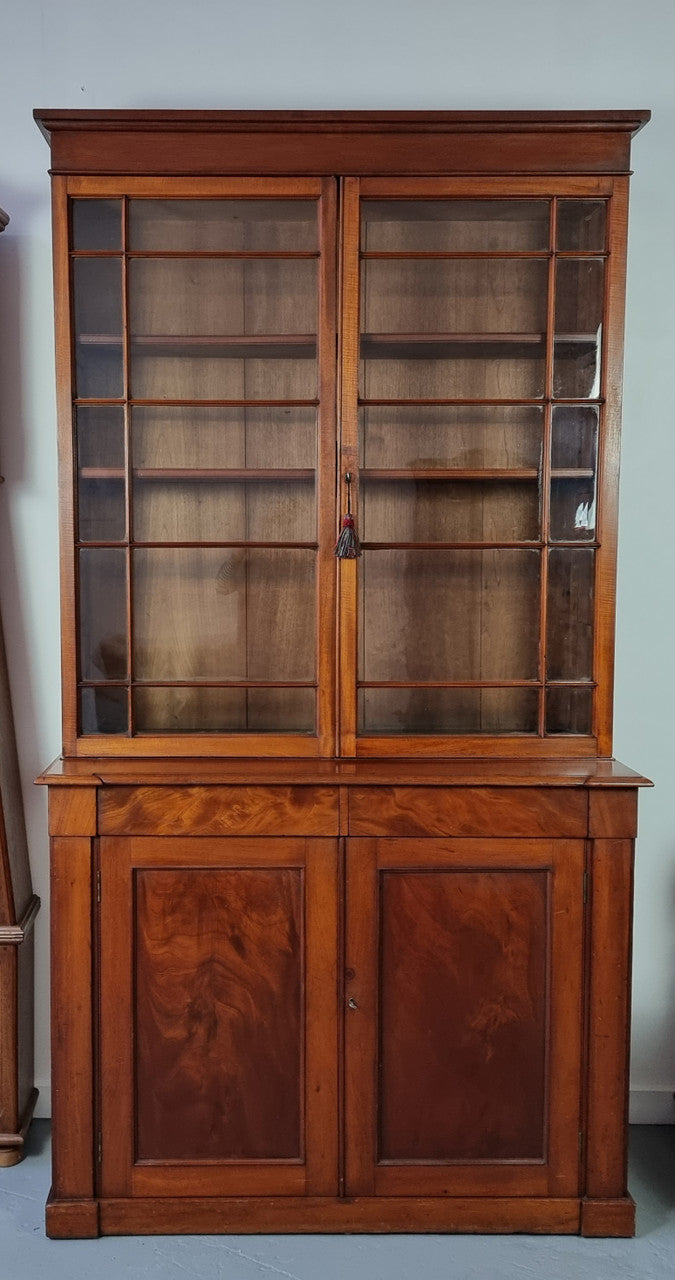 Rare early Australian colonial full Cedar bookcase. Plenty of storage underneath and glass top doors open up too three fully adjustable shelves. In good restored condition.