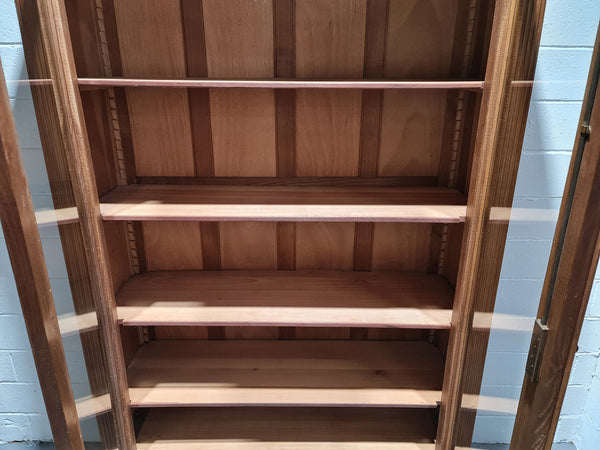 Stunning French Henry II style Walnut two door bookcase. In good original detailed condition.