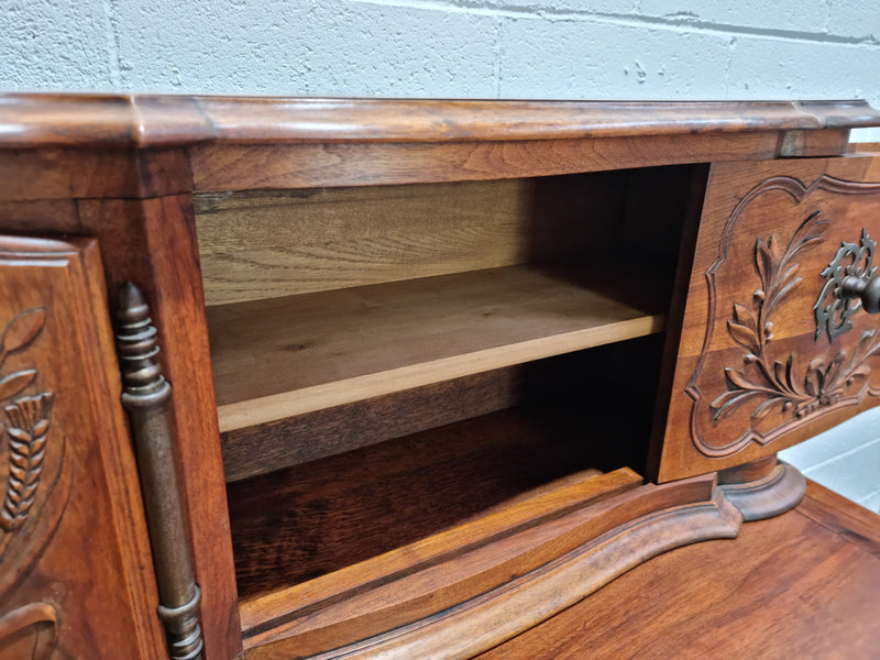Stunning 19th Century French Walnut Buffet à Glissant from Provence, France. This is an exceptional charming piece and very functional with plenty of storage space, two large cupboards at the bottom, two drawers in the middle and two sliding doors either side at the top and finished off with a small central cupboard. In good original detailed condition.