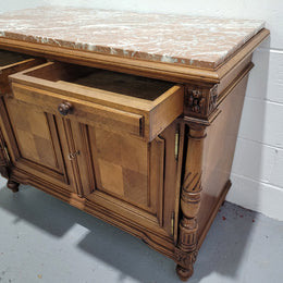 Stunning French walnut Henry II style marble top side cabinet with two drawers and two shelves inside. In good original detailed condition.